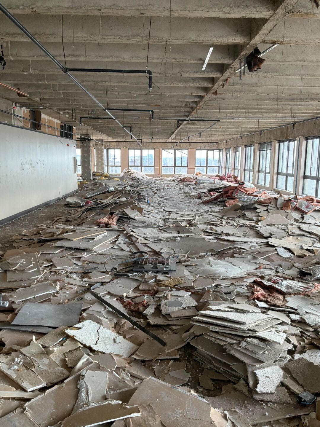Full-floor interior gut-out and debris removal in a high-rise